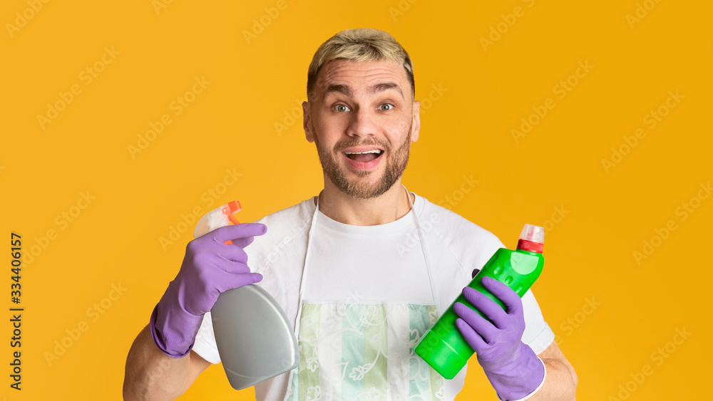 Guy with cleaning supplies in his hands Guy with cleaning supplies in his hands
