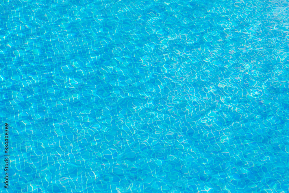 background of blue small tiles at a swimming pool as harmonic background with waves