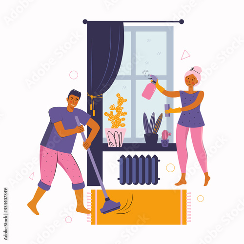 Man and a woman spend time together at home. Young couple is cleaning the room, disinfects, washes the window and sweeps the floor. Stay at home together. Spending time at home. Happy family