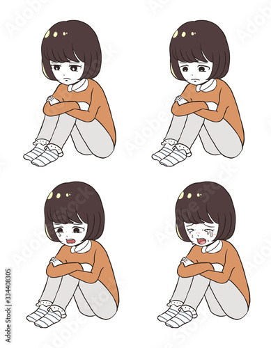 座って落ち込む女子