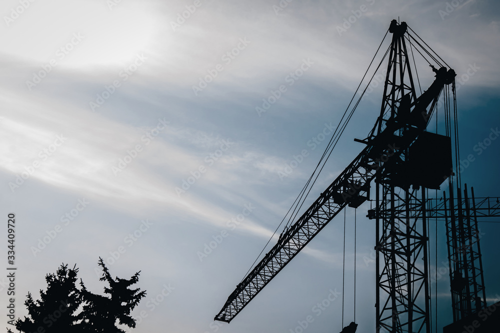 construction work at dawn, silhouette crane construction work at dawn, silhouette crane