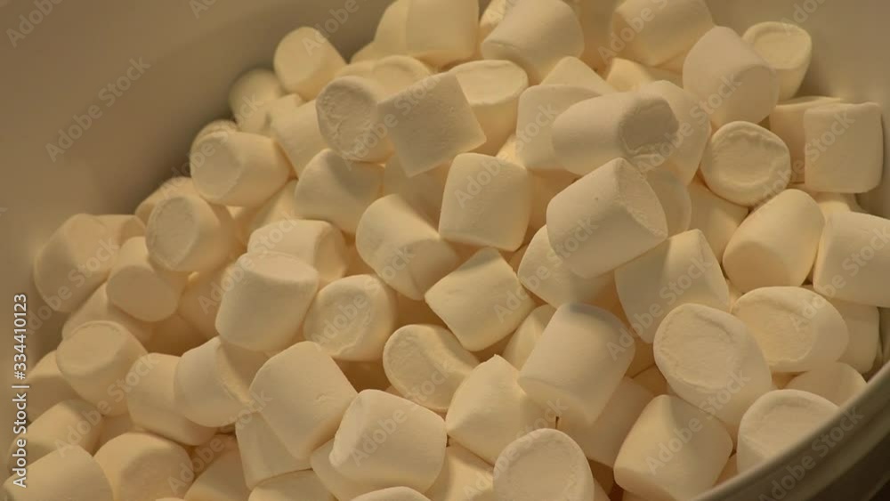 Pouring a large amount of marshmallows into a beer brewing tank. Pouring a large amount of marshmallows into a beer brewing tank.