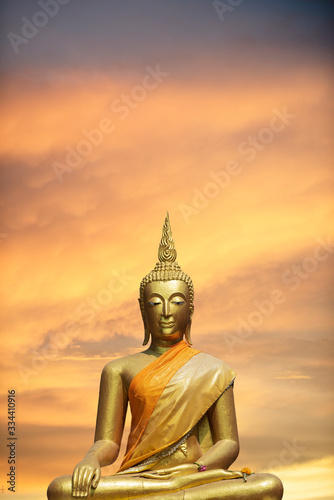 A peaceful superimposed or double exposure images of Golden Buddha statue with a nice background from Ayuthaya  Thailand. Buddha statue is posing    The attitude of subduing Mara .