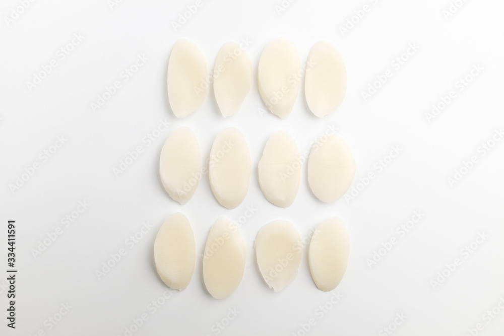 White rice cake sliced on white background White rice cake sliced on white background