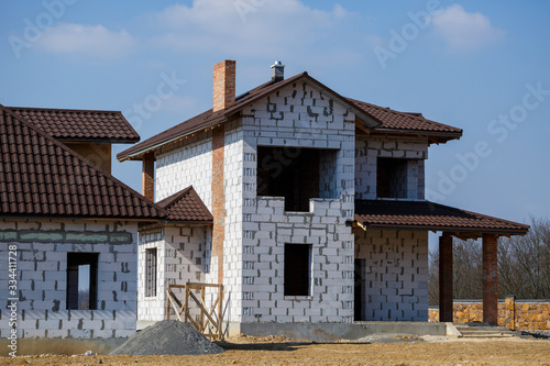 construction of a country two-story house from a gas block