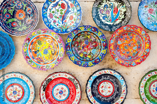 Close-up view of colorful Turkish plates displayed at an outdoor souvenir stand in Istanbul, Turkey