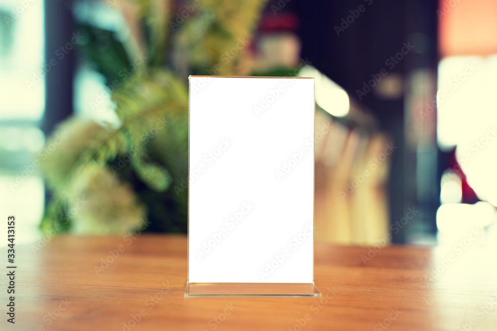 Mock up Menu frame standing on wood table in Bar restaurant cafe. space for text Mock up Menu frame standing on wood table in Bar restaurant cafe. space for text