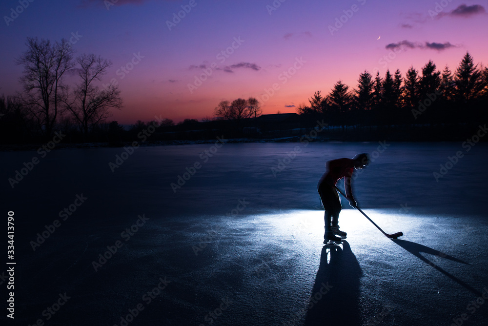 Hockey player silhouette on ice, sport photo