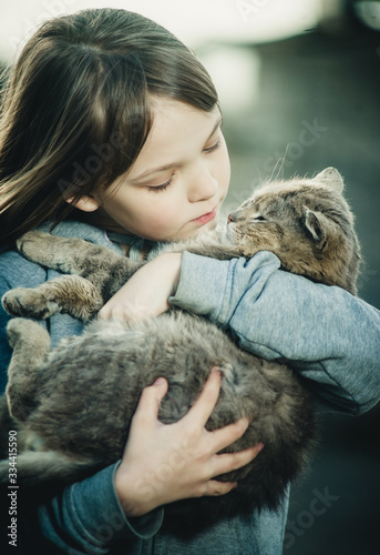 beautiful girl with a gray cat