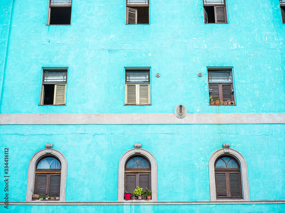 colorful turquoise facade of old house