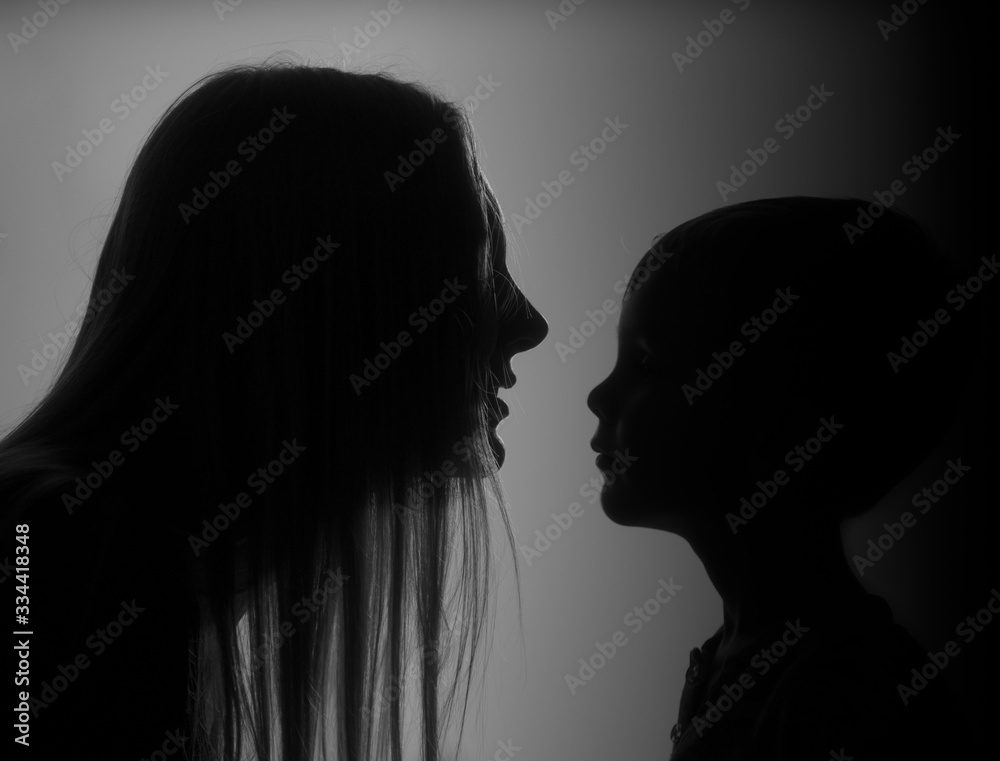 silhouette of a mother with son