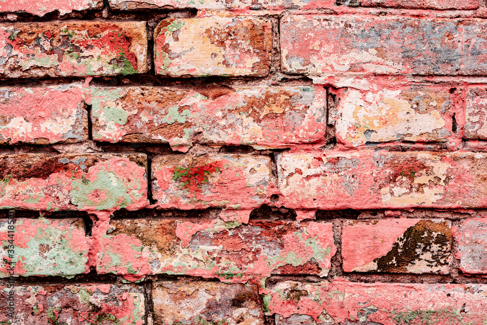 Texture of a brick wall with cracks and scratches which can be used as a background Texture of a brick wall with cracks and scratches which can be used as a background