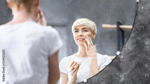 Middle-Aged Woman Applying Cream Caring For Skin At Home, Panorama