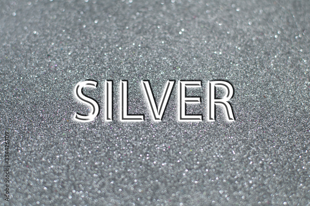 Fototapeta premium Silver text on gray shiny background.