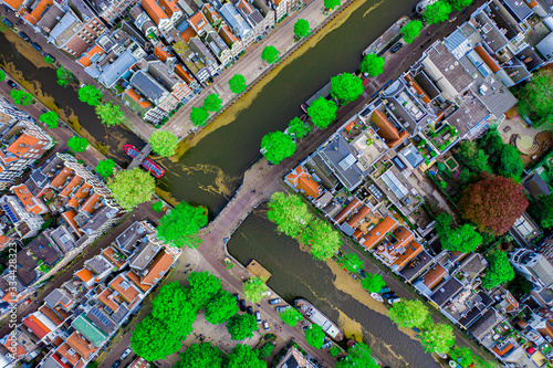 Aerial drone top down photo of Amsterdam canals with leisure boats