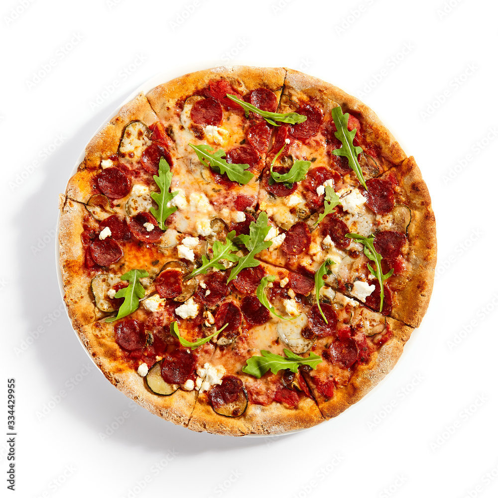 Pepperoni pizza slices with arugula on plate Pepperoni pizza slices with arugula on plate