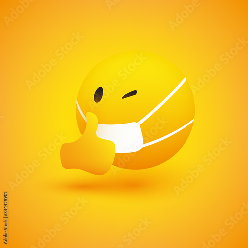 Emoji - Simple Emoticon with Winking Eye, Showing Thumbs Up and Wearing Medical Mask - Vector Design on Yellow Background