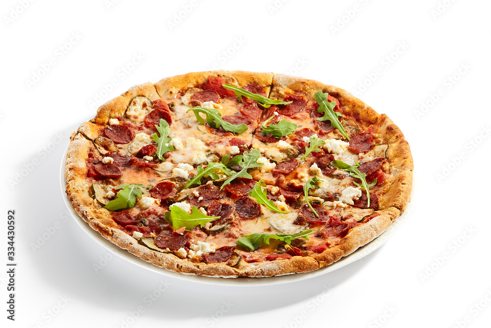 Pepperoni pizza slices with arugula on plate Pepperoni pizza slices with arugula on plate