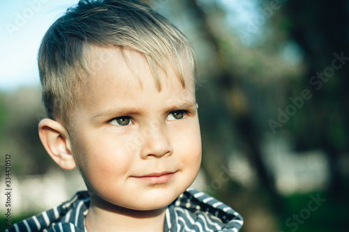 close-up portrait of a little boy with blond hair