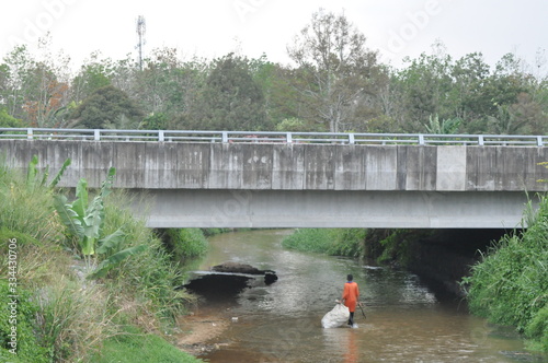 recycled item collector activity at the river