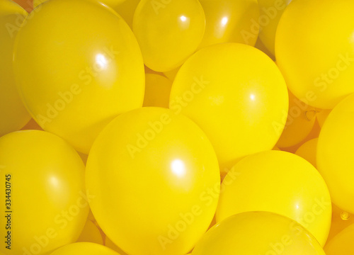 Group of yellow balloons create a background