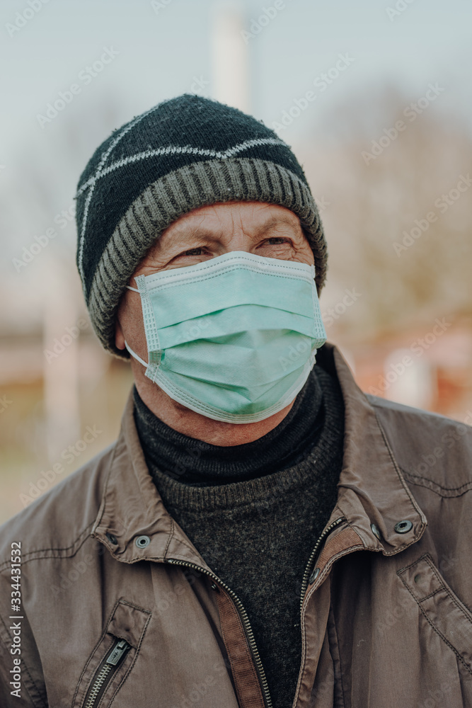 elderly man wearing facial mask to prevention of infection