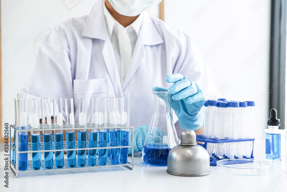 Biochemistry laboratory research, Chemist is analyzing sample in laboratory with equipment and science experiments glassware containing chemical liquid Biochemistry laboratory research, Chemist is analyzing sample in laboratory with equipment and science experiments glassware containing chemical liquid