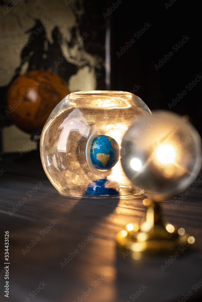 Earth under a glass bell. Quarantine, pandemic concept in the world COVID-19 Earth under a glass bell. Quarantine, pandemic concept in the world COVID-19