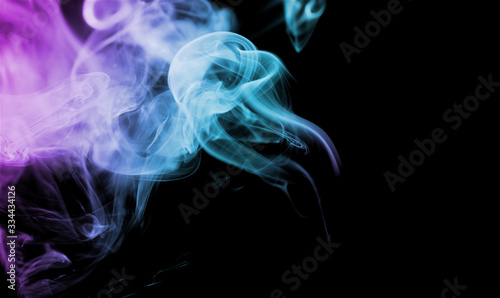 Beautiful multicolored smoke on a black background