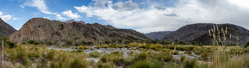 Mountain and valley view along Wadi Sahtan road and snake canyon in Al Hajir mountains between Nizwa and Mascat in Oman Mountain and valley view along Wadi Sahtan road and snake canyon in Al Hajir mountains between Nizwa and Mascat in Oman