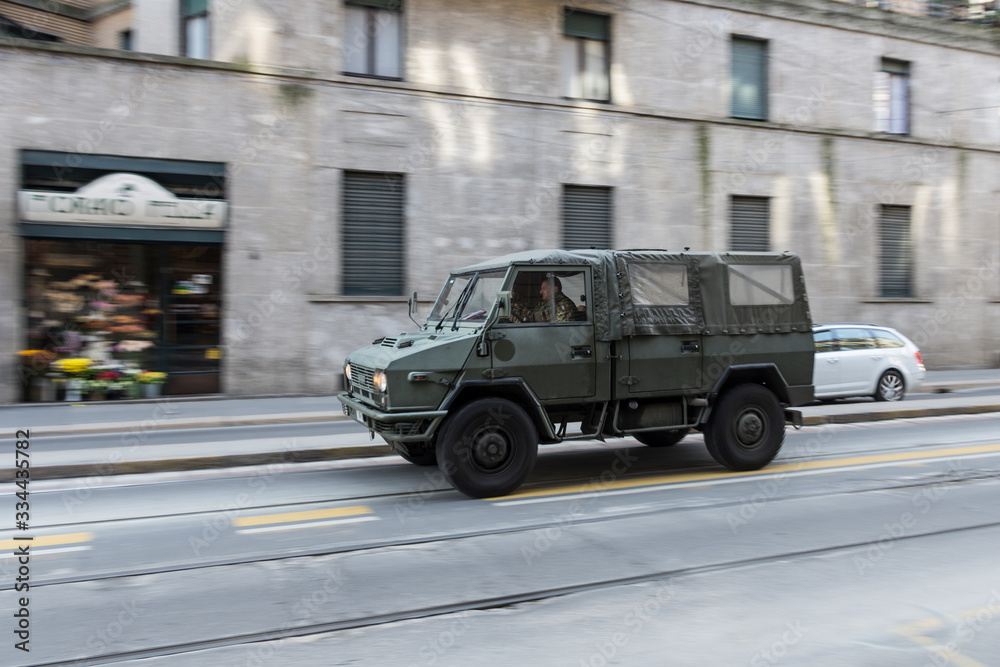 military transport vehicle through the streets of the city
