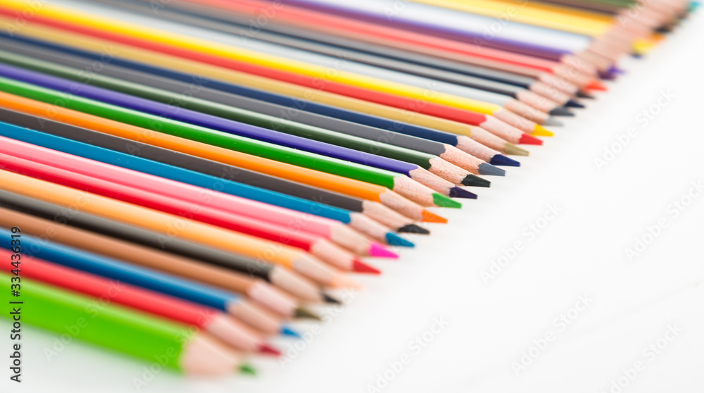 Fototapeta premium colored pencils lying in row