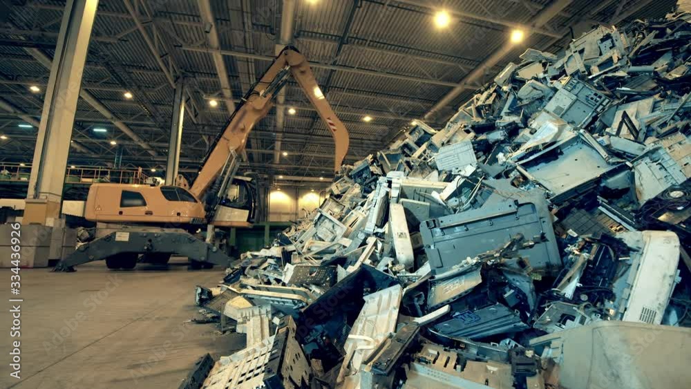 Debris of office machines in the indoors dumpsite