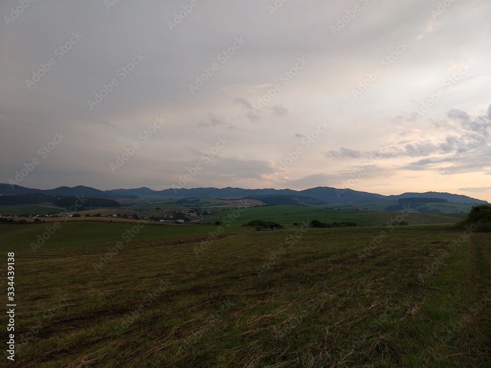 Fototapeta premium Sunrise or sunset over the hills and meadow. Slovakia