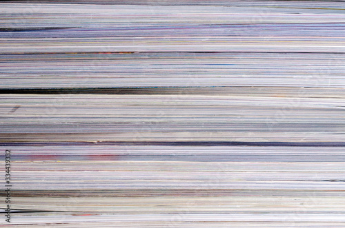 Closeup background of a pile of magazines.