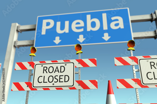 Barriers near Puebla city traffic sign. Coronavirus disease quarantine or lockdown in Mexico conceptual 3D rendering © Alexey Novikov