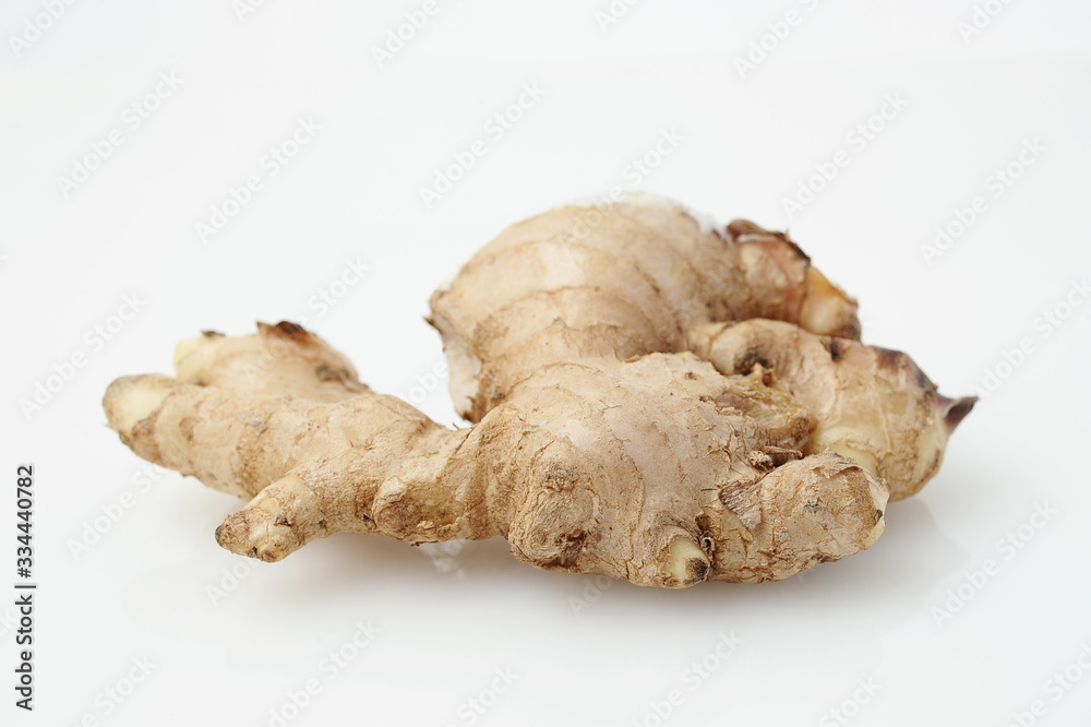 Close up of Fresh Ginger root or rhizome isolated on white Close up of Fresh Ginger root or rhizome isolated on white