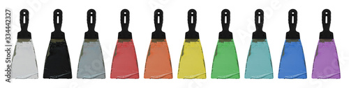 Multi-colored paint on a spatula isolated