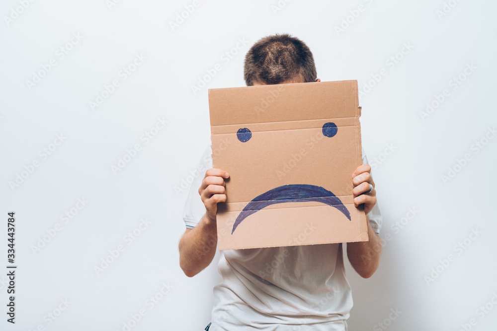 man holding a picture with a unhappy smiley man holding a picture with a unhappy smiley