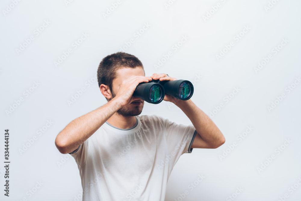 man with binoculars. gray background man with binoculars. gray background