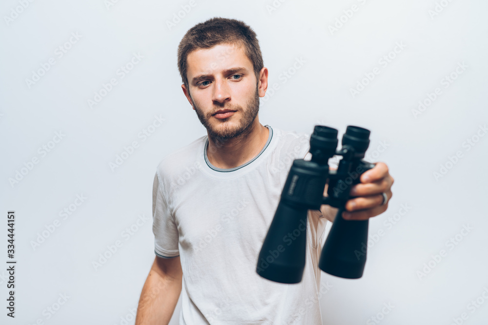 man with binoculars. gray background man with binoculars. gray background