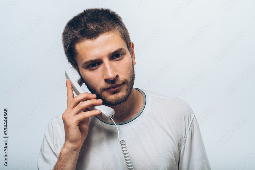 man talking on landline man talking on landline