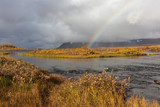 Rainbow over river in the Arctic mountains of a Sarek National Park.