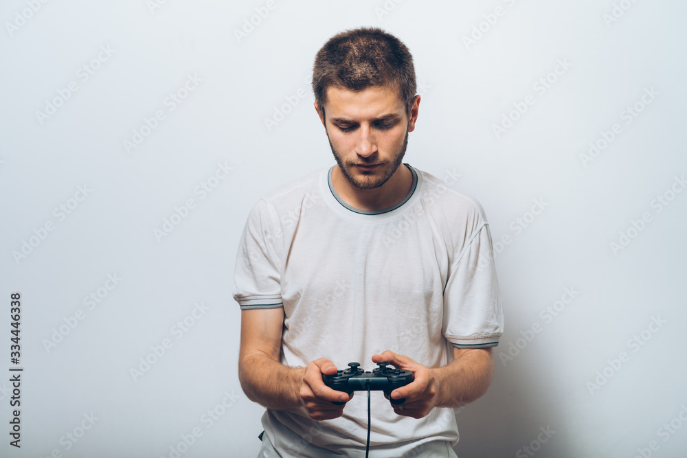 Man playing on the joystick in a game console Man playing on the joystick in a game console