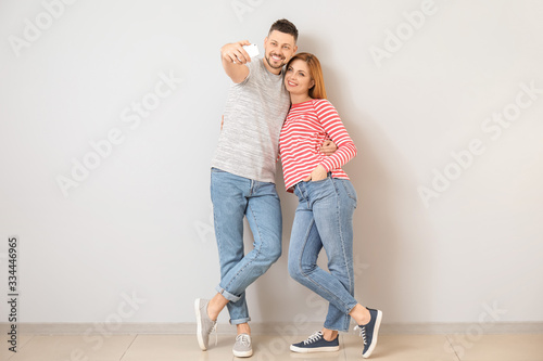Couple taking selfie near l...