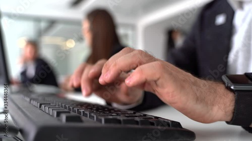 hands typing on a computer, close-up, a call center employee responds to a message