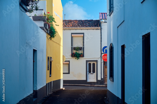 Narrow street in Ponta Delgada, Azores, Portugal. © badahos