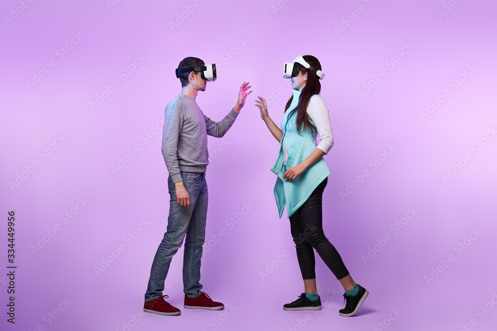 Fototapeta premium Couple in love communicate using a virtual reality headset.