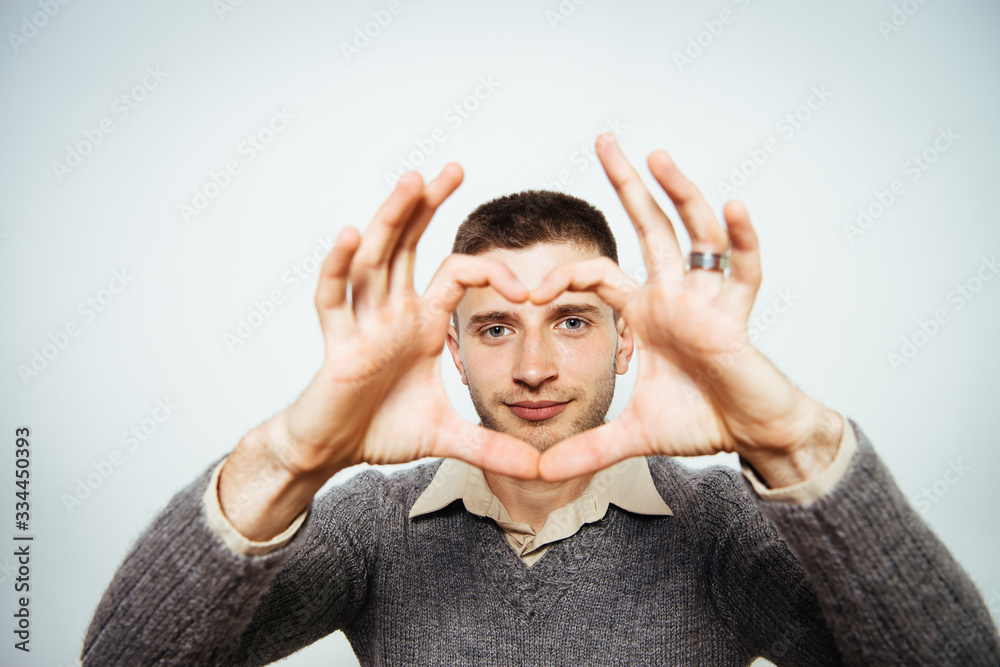 man making a hand heart frame man making a hand heart frame