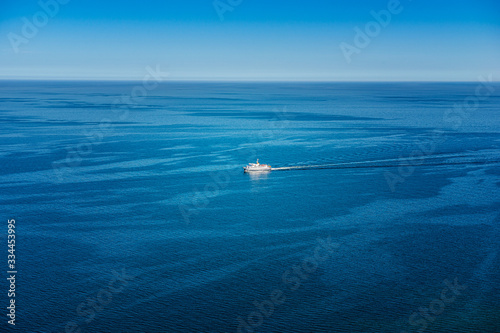 View of the endless sea from the cliff on Rugen. In the background a small excursion ship.